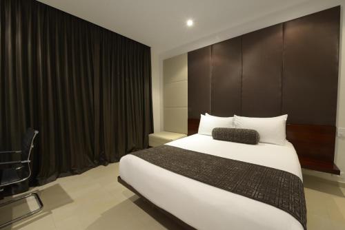 Postel nebo postele na pokoji v ubytování Lamana Hotel