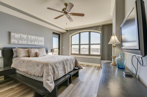 a bedroom with a bed and a flat screen tv at Emerald Grande Condo Beach, Marina and Ocean View in Destin