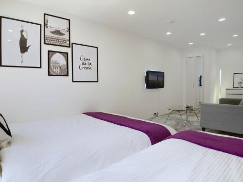 Un pat sau paturi într-o cameră la Guesthouse Nakatsu - Vacation STAY 14904