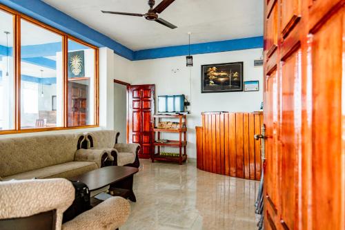 a living room with a couch and a table at Golden View Guest in Ella