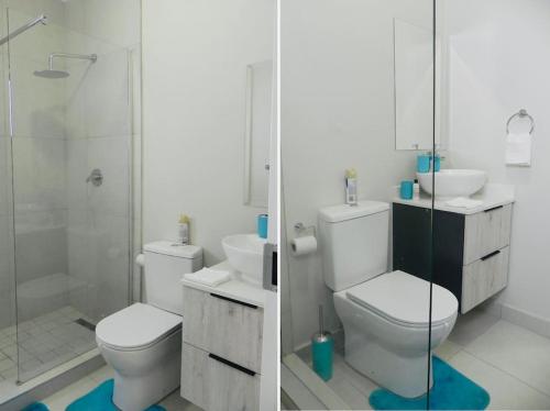 a bathroom with a toilet and a sink and a shower at Bounce Modern Home of Comfort 2 in Midrand