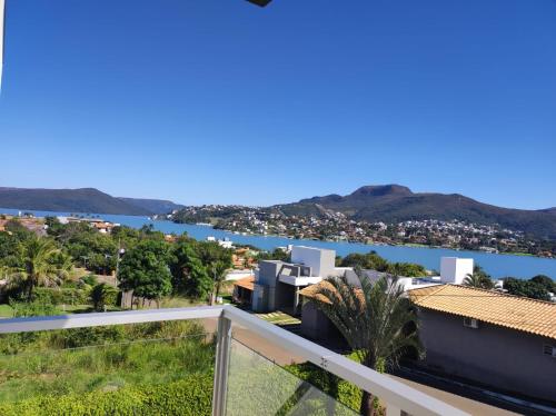 a view of the water from the balcony of a house at Pousada Vale do Sol Capitólio in Capitólio