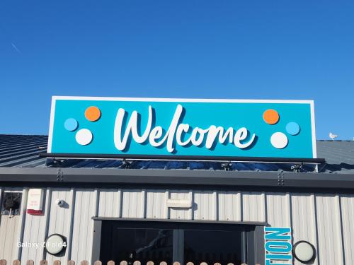 a welcome sign on the top of a building at Seaview in Leysdown-on-Sea