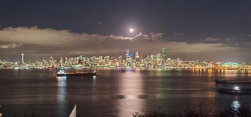 a view of a city at night from the water at 180 degree, unobstructed bluff view! in Seattle