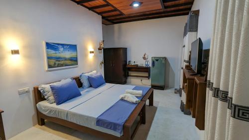 Postel nebo postele na pokoji v ubytování Jennifer's Villa