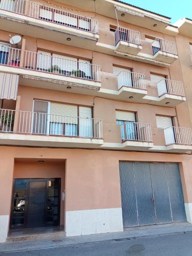 an apartment building with balconies and a door at Ebro Escape Luxury Apartment in Móra d'Ebre