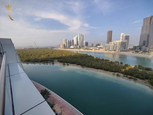 a view of a river in a city with buildings at Majestic Studio - Cozy Living in Al Reem, Near Reem Mall in Abu Dhabi