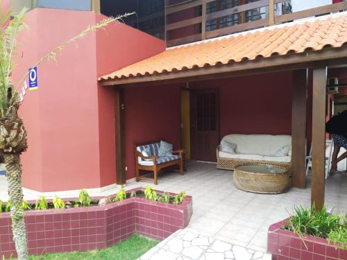 a patio with a bed in a building at Golden Residence in Florianópolis