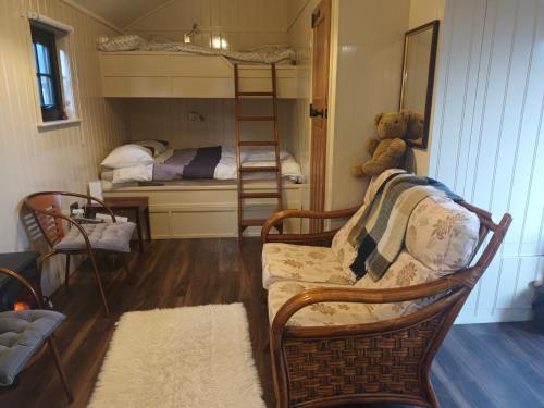 a living room with a couch and two bunk beds at Rathgillen Cabin in Nobber