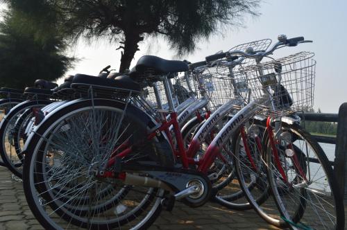 a group of bikes parked next to a fence at Villa Orchid Garden Riverside Hoi An in Hoi An