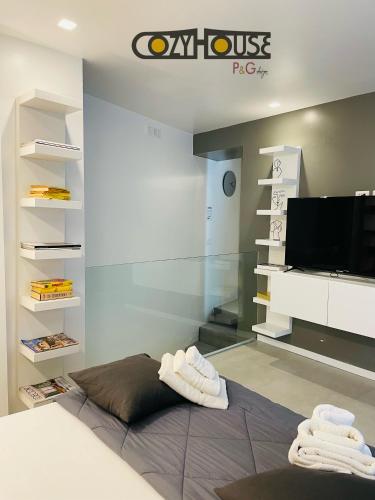 Ένα ή περισσότερα κρεβάτια σε δωμάτιο στο Cozy House