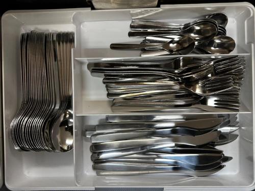 a drawer full of silver utensils in a drawer at FUJIYUKI in Yamanakako