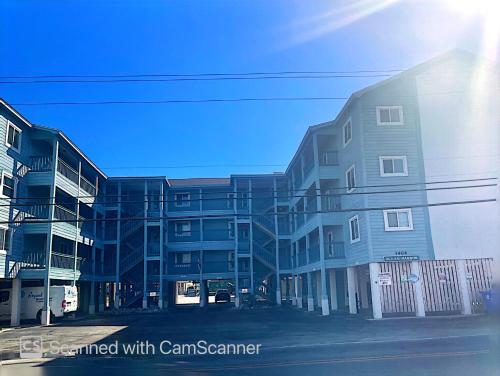 a group ofartment buildings on the side of a street at Bikini Bottom in Carolina Beach
