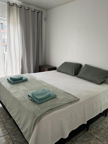 Ένα ή περισσότερα κρεβάτια σε δωμάτιο στο 1o Andar Apartamento