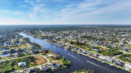 an aerial view of a city with a river at 15826 Aqua in Placida