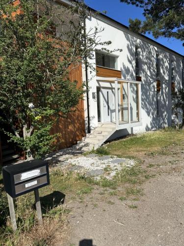 a building with a sign in front of it at Kulladal 1 in Malmö