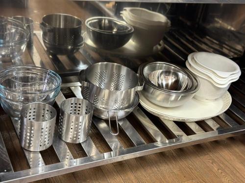 a group of measuring cups and bowls on a tray at FUJIYUKI in Yamanakako