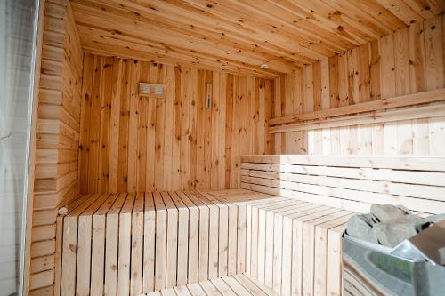 a wooden sauna with wooden walls and ceilings at Casa Mecva in Borşa