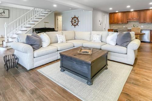 a living room with a white couch and a table at Candlewood Lake House in Danbury