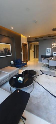 a living room with a couch and a table at Luxury apartments - Damac tower in Riyadh