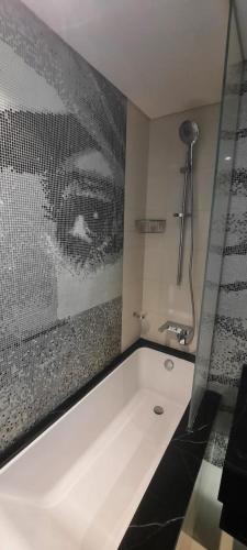 a bath tub in a bathroom with a shower at Luxury apartments - Damac tower in Riyadh