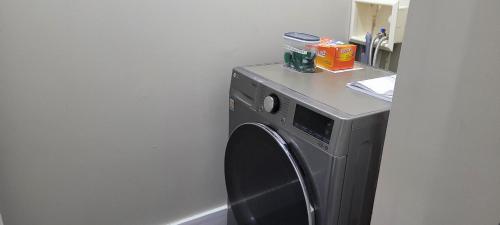 a washing machine with a counter on top of it at Smart Stylish Downtown Condo- 2 bedrooms in Saskatoon