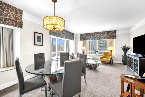 a living room with a dining table and a living room at Spacious 2 Bedroom 2 Bath & Studio Suites in the Four Seasons Hotel Miami High floors in Miami