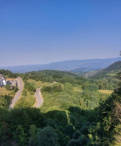 a view of a road in the hills at Milmari Apartments Pahulja N Lux in Kopaonik