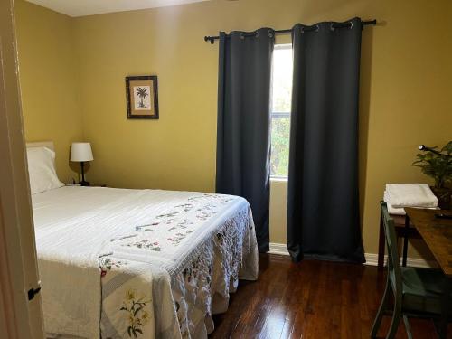 a bedroom with a bed and a window at Park View West in Lakeland