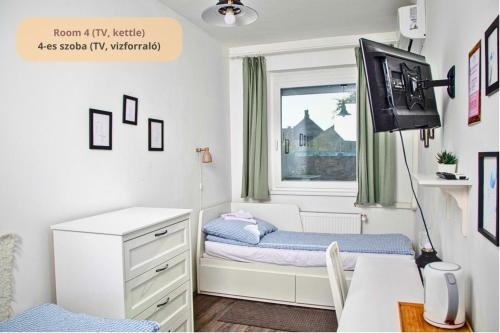 Postel nebo postele na pokoji v ubytování Tulip Home Guest House