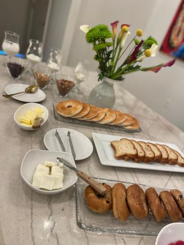 a table with bread and cheese and other food on it at Serenity in the Marigny in New Orleans