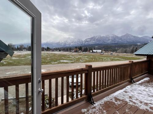 a balcony with a view of snow covered mountains at Mountain Magic in Golden