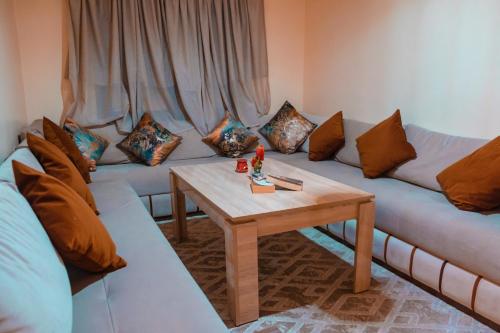 a living room with a couch and a table at Simons house in Marrakech