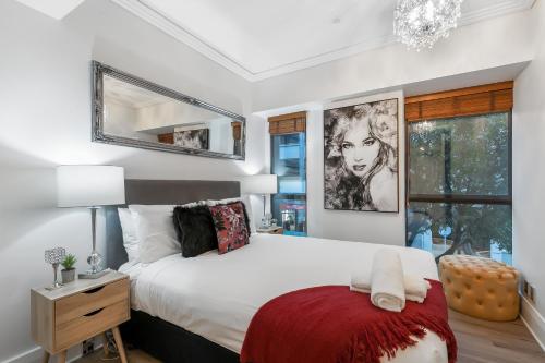 a bedroom with a large bed and a window at Your Next Viaduct Getaway! in Auckland
