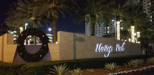 a sign for the hilton dublin city at night at Ocean Reserve in Sunny Isles Beach