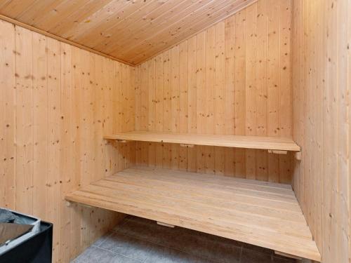 a wooden sauna with wooden shelves in it at 10 person holiday home in Fjerritslev-By Traum in Fjerritslev