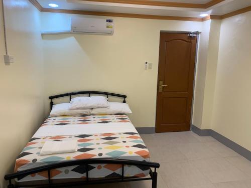 Postel nebo postele na pokoji v ubytování ZL TRAVELERS INN
