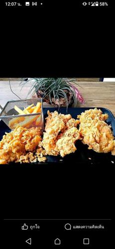 a blue plate of food on a table at Mateoasis in Ko Kood