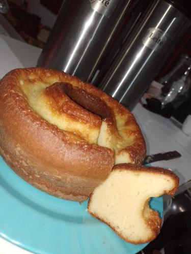 a pastry on a blue plate with a piece of bread at Pousada Pôr do Sol in Barra Grande