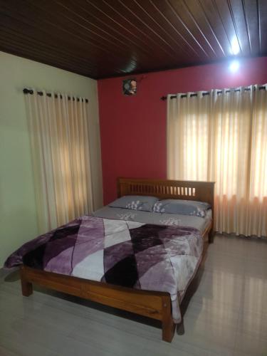 A bed or beds in a room at Dreams Homestay