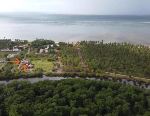 an aerial view of an island in the water at Villas do Rio 02 in Pôrto de Pedras