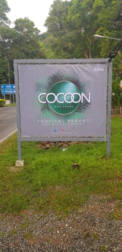 a sign on the side of a road at COCOON Koh Chang in Ko Chang