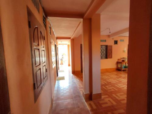 a hallway of a house with a hallwayngth at phoulisack guesthouse in Ban Sôphoun