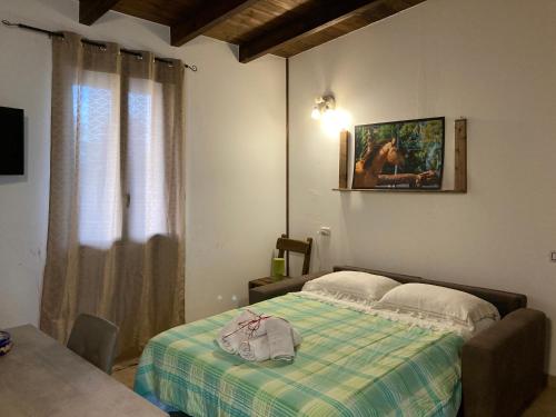 Säng eller sängar i ett rum på La Pineta dei Cavalli