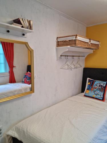 a bedroom with a mirror and a bed and a bed sidx sidx sidx at Sophie House foreigners women only in Seoul