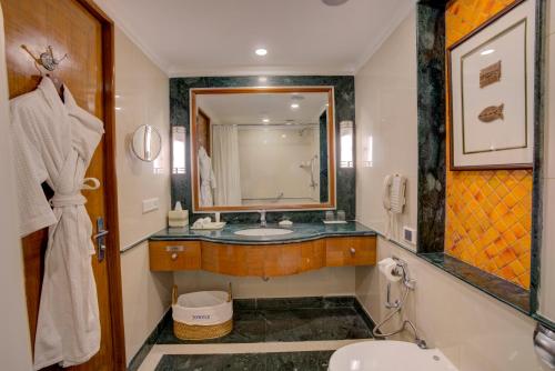a bathroom with a sink and a mirror at ITC Rajputana, a Luxury Collection Hotel, Jaipur in Jaipur