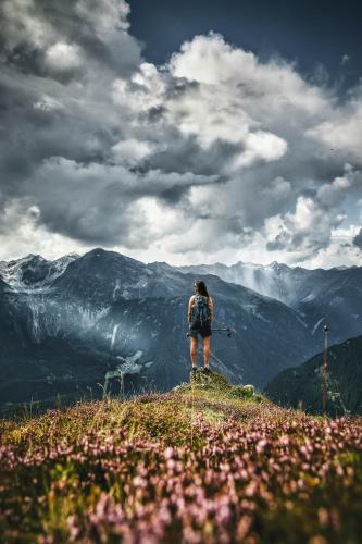a person standing on top of a mountain at Ferienhaus Knor in Umhausen