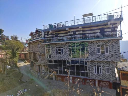a building under construction with scaffolding on it at Vintage Woods Inn in Shimla