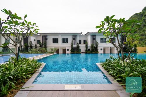 an image of a swimming pool at a resort at JOMSTAY Sunway Onsen Suites Ipoh - Lost World of Tambun Ipoh Waterpark in Tambun