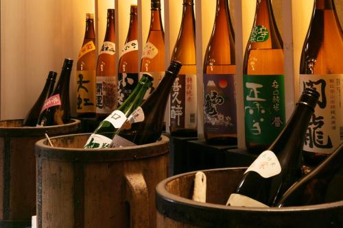 a bunch of bottles of wine in barrels at AWA Nishi-Izu in Numazu